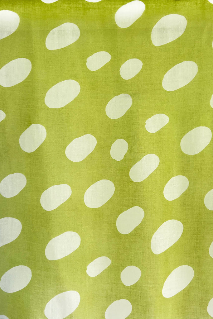 A Wool Scarf with green and white polka dots by See Design.