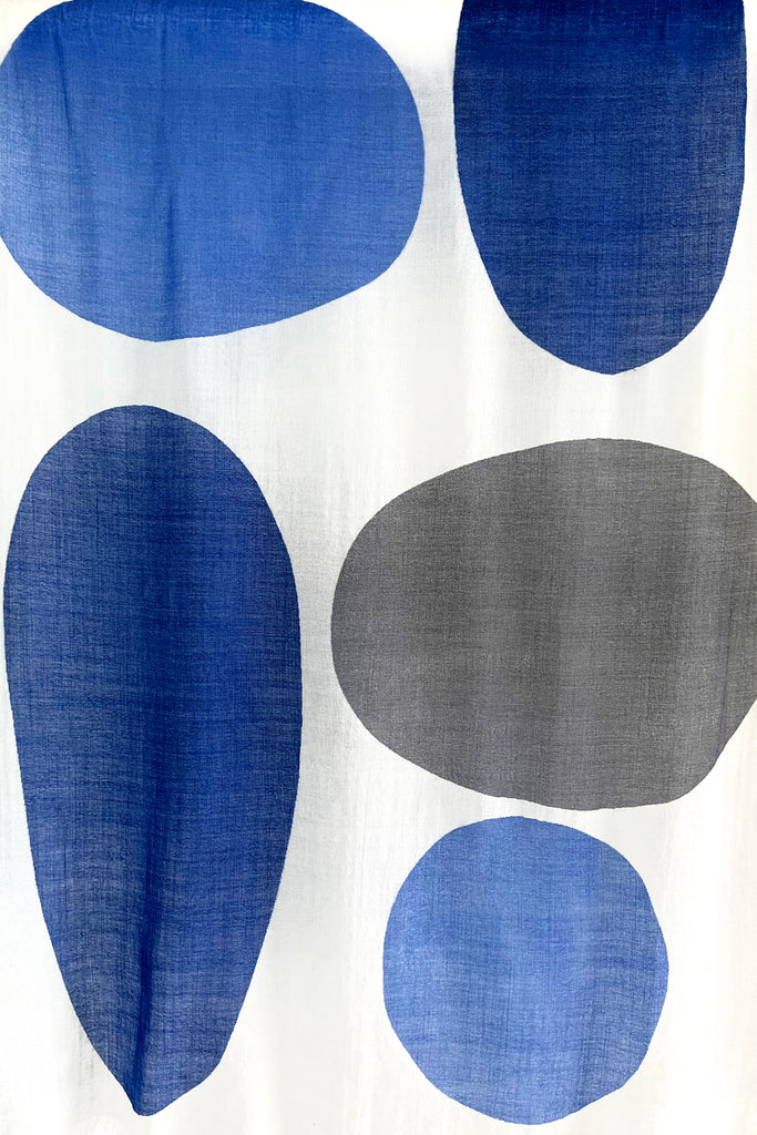 A See Design wool scarf with blue and grey circles on it.