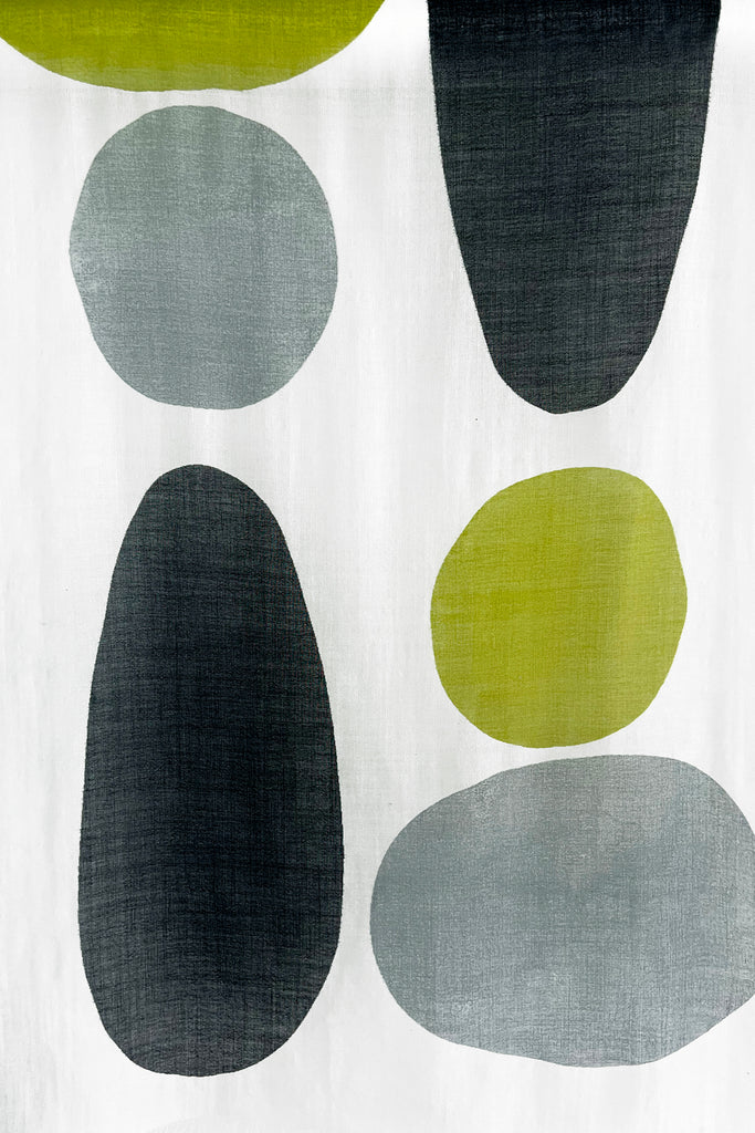 A bright patterned See Design summer wool scarf.