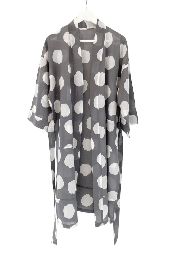 A lightweight cotton voile See Design kimono robe hanging on a hanger.