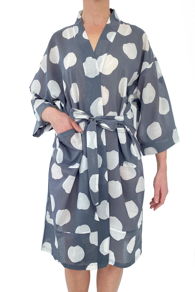 A woman wearing a lightweight cotton voile See Design kimono robe.