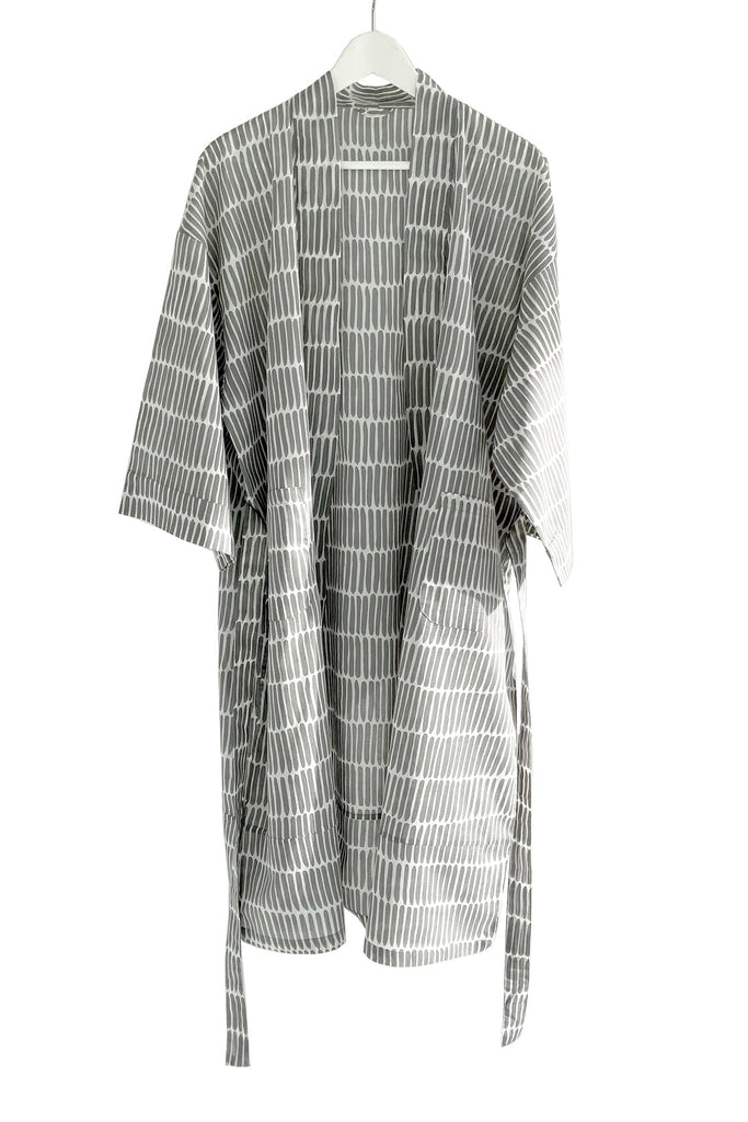 A lightweight cotton voile See Design kimono robe draped on a hanger.