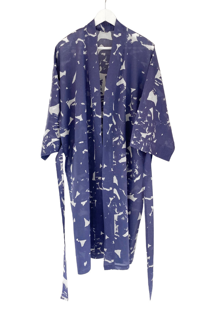 A lightweight cotton voile See Design kimono robe hanging on a hanger, perfect for lounging.