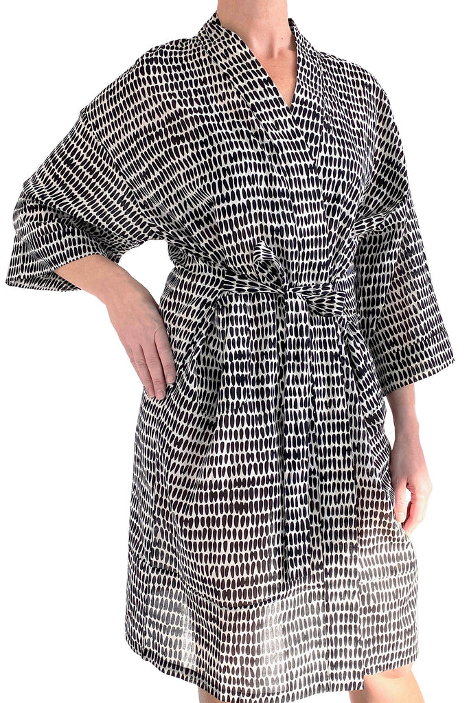 A woman wearing a See Design kimono robe.