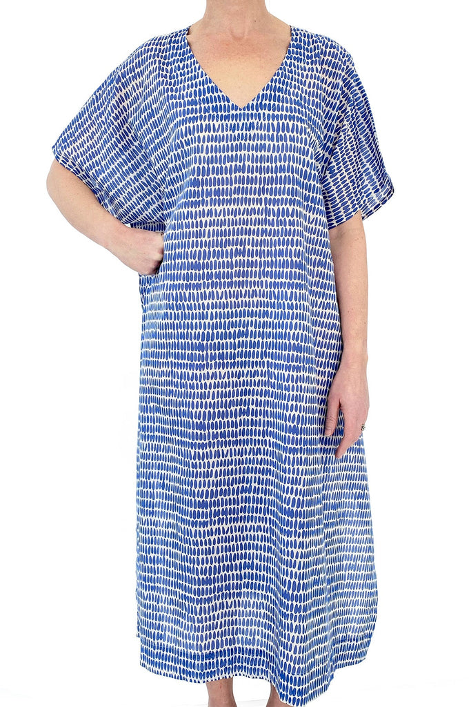 A woman wearing a See Design Caftan Long beach cover up.