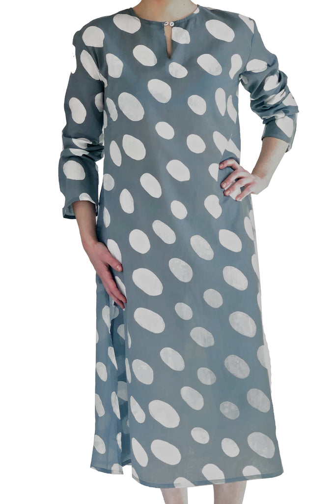 A woman wearing a See Design lightweight and soft cotton voile polka dot Tunic Full Length dress.