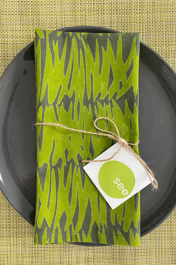A See Design hand painted cotton napkin set with a tag.
