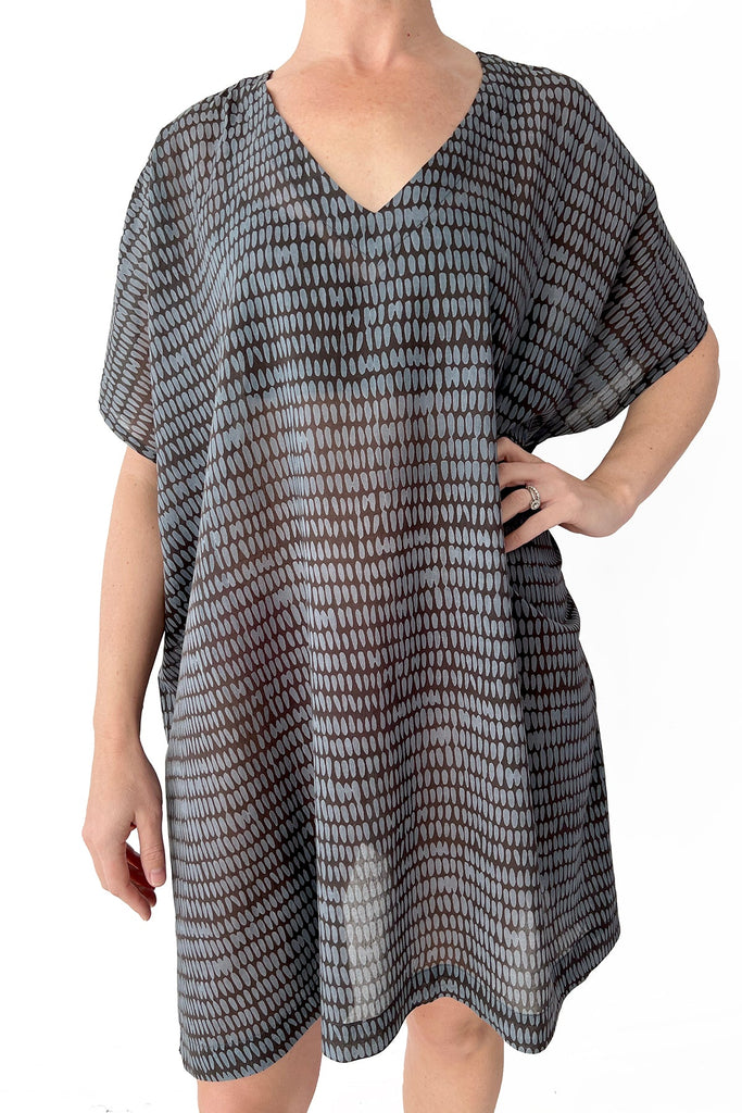 A woman wearing a lightweight See Design caftan dress.