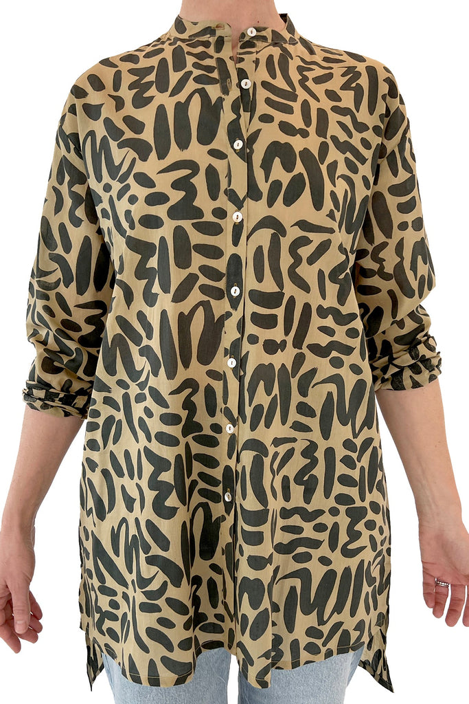 A fashionable woman wearing a comfortable See Design animal print long shirt.