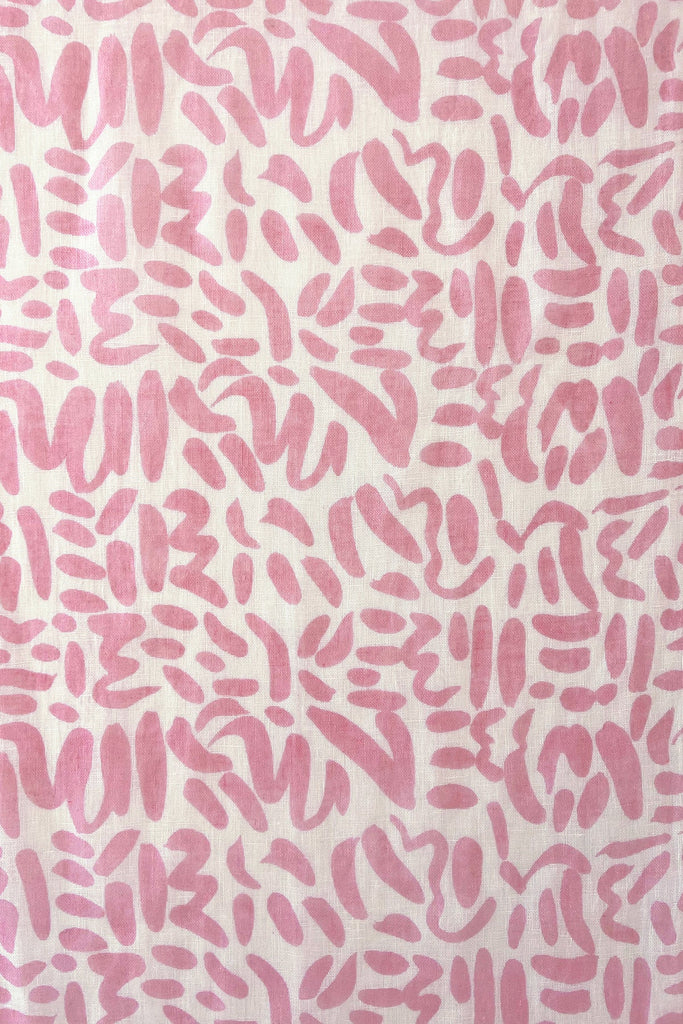 A pink and white pattern on a white background with a modern design element, the Linen Scarf by See Design.