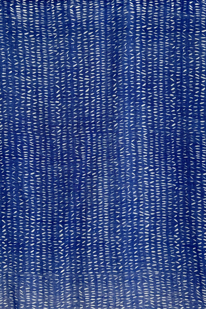 A bright blue Wool Scarf with white lines on it, See Design.