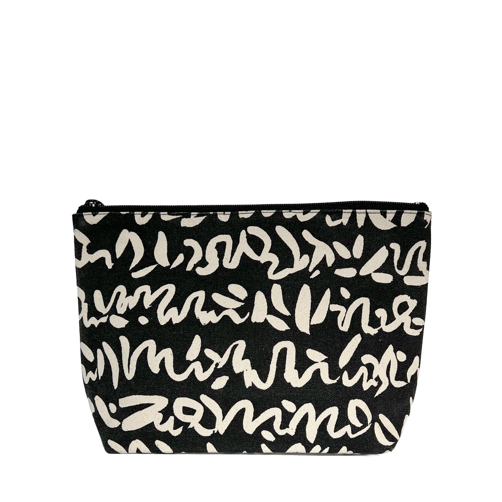 A black and white See Design Travel Pouch Large.