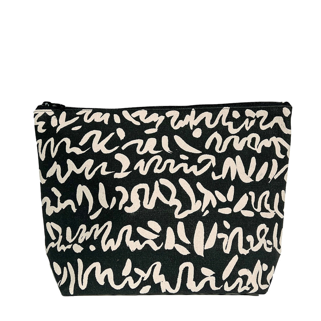 An extra large See Design canvas travel pouch with writing on it.