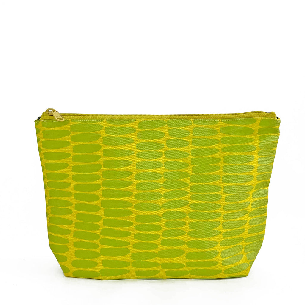 A green and yellow zippered See Design Travel Pouch Large.