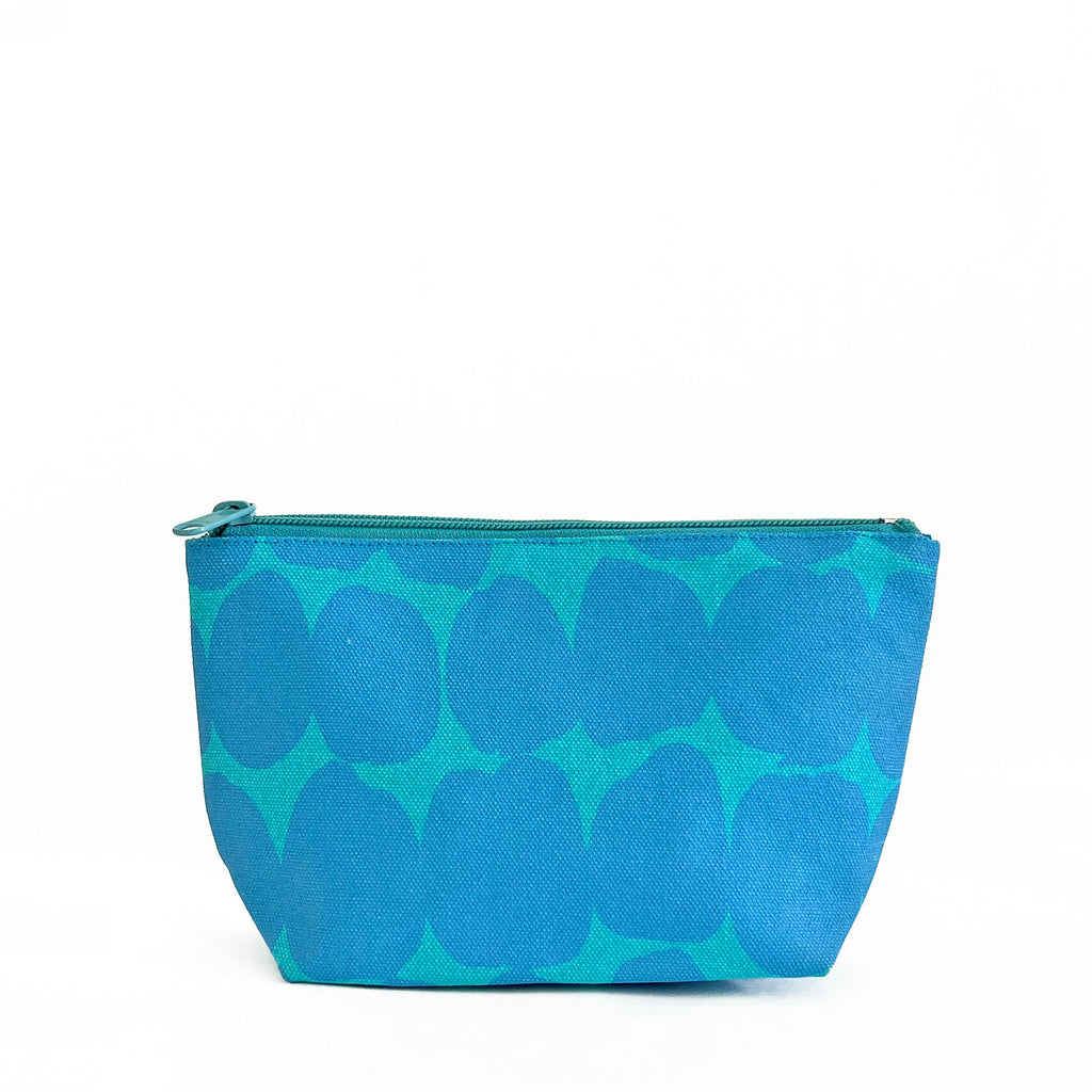 A compact See Design blue and green Travel Pouch Small on a white background.