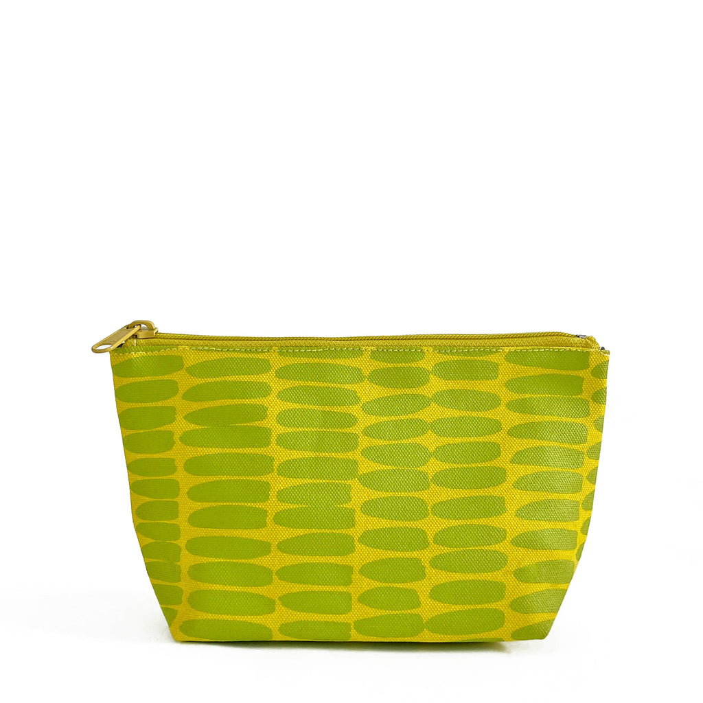 A compact green and yellow See Design Travel Pouch Small with a zipper.
