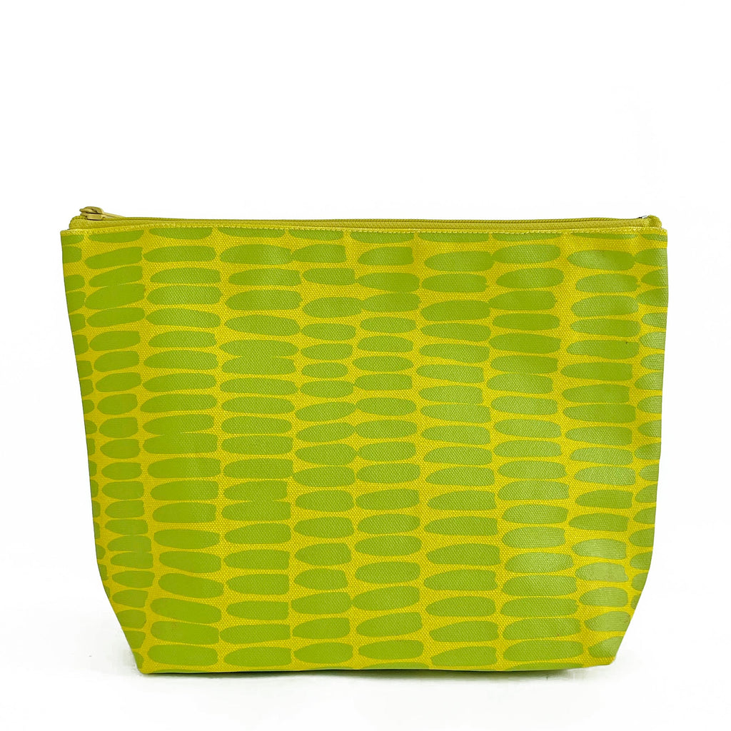 A lime green See Design extra large travel pouch with a nylon lining.