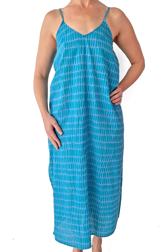 A woman wearing a See Design slip dress.
